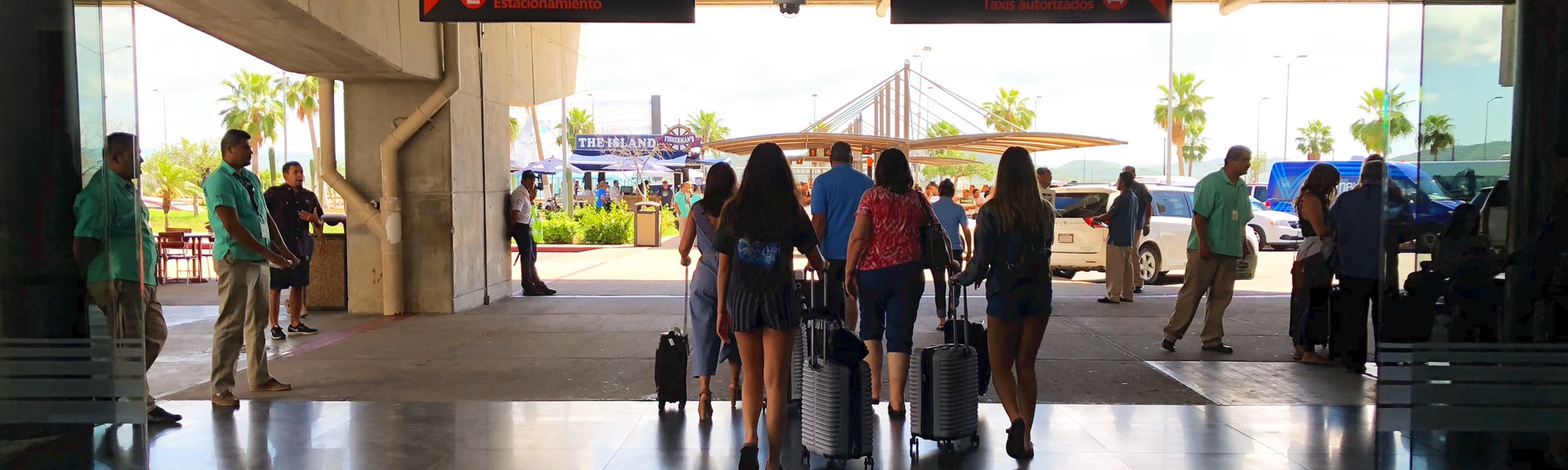 Crowds of Tourists walk through SJD Airport